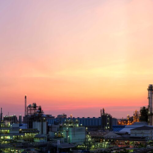 Sunset over skyline with industry